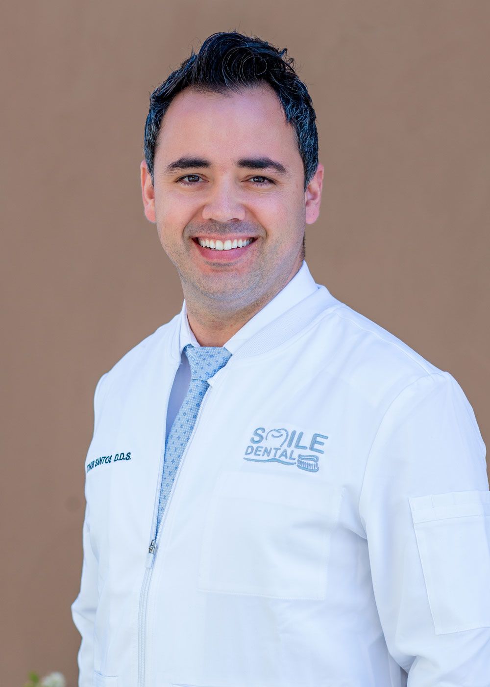 Dr. Santos in a Smile Dental coat